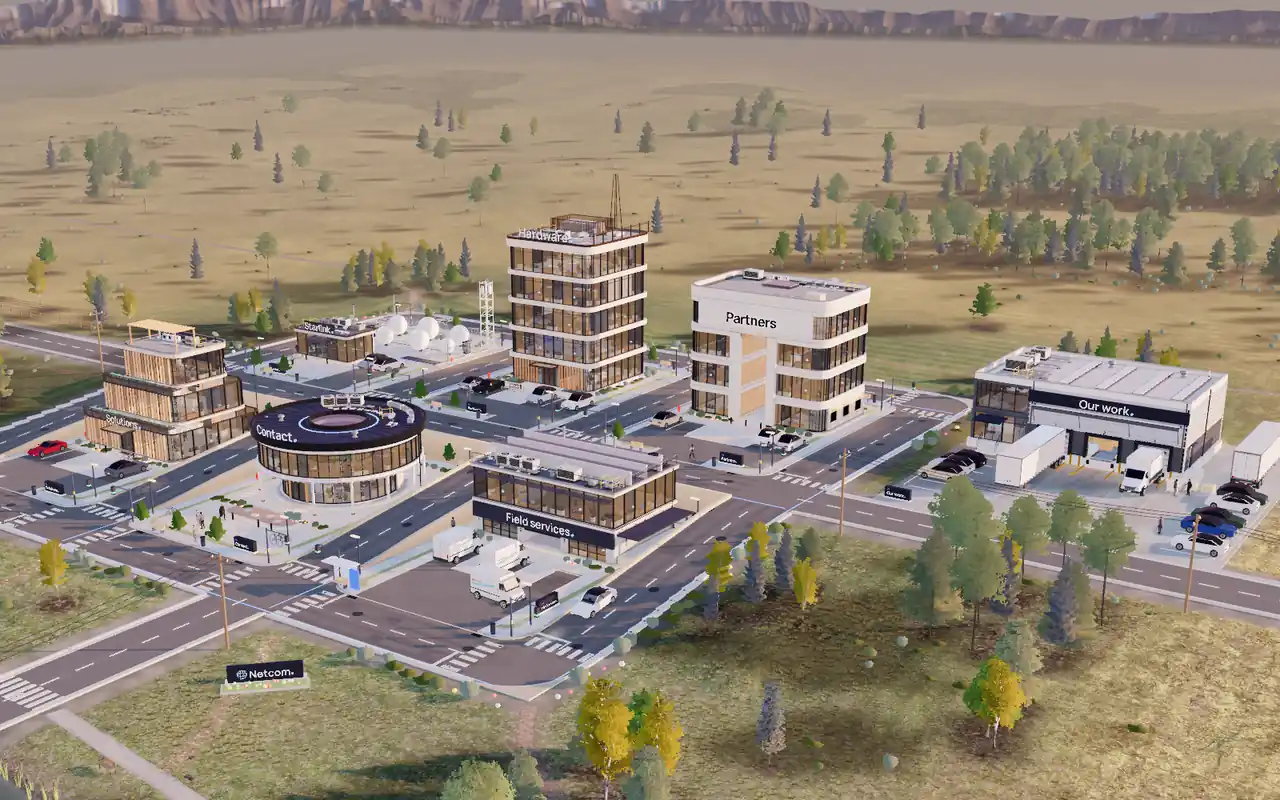 The Netcom business park at golden hour: seven buildings on a grid of streets in open Colorado country.