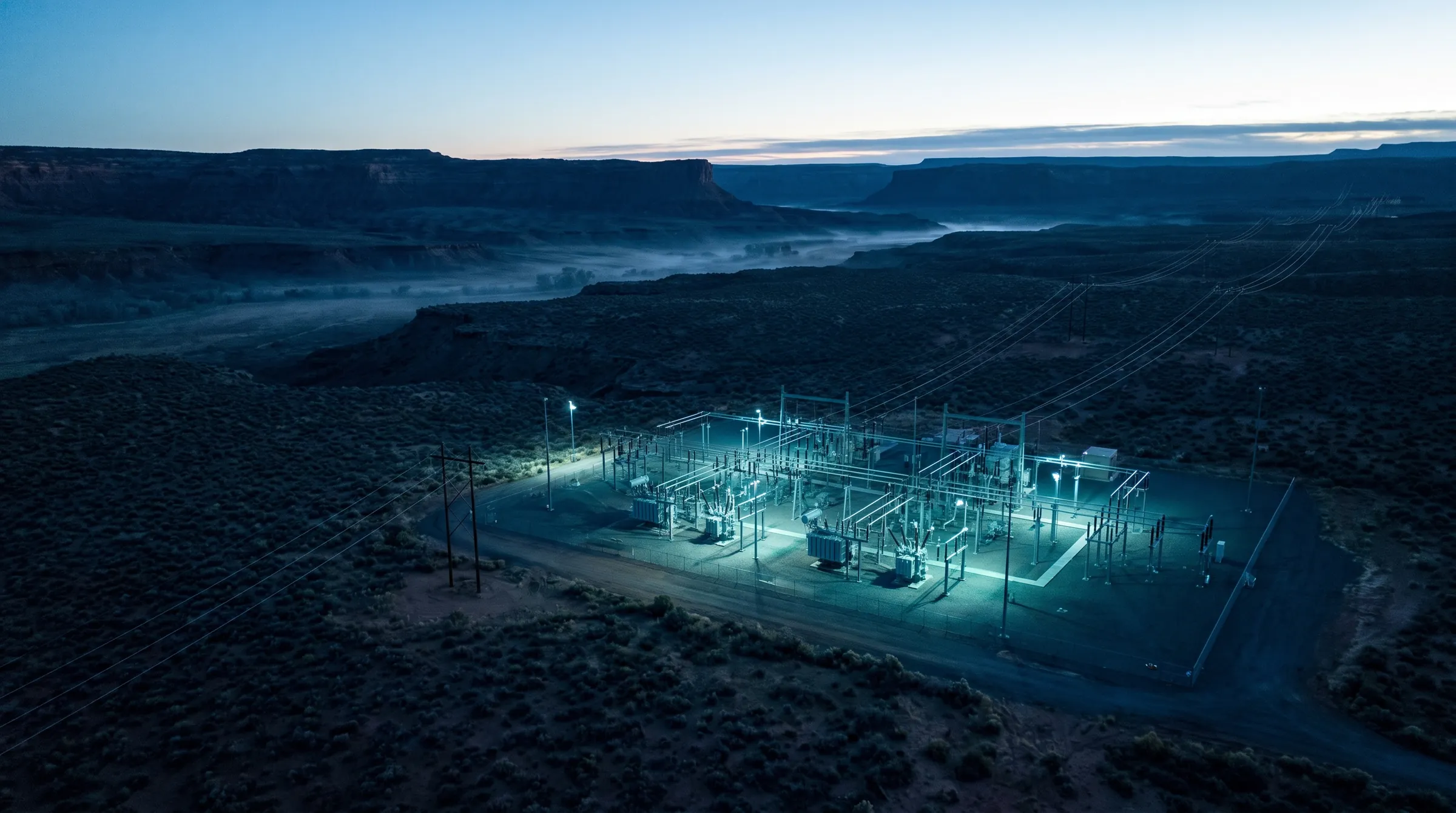 Aerial view of an electrical substation at dusk