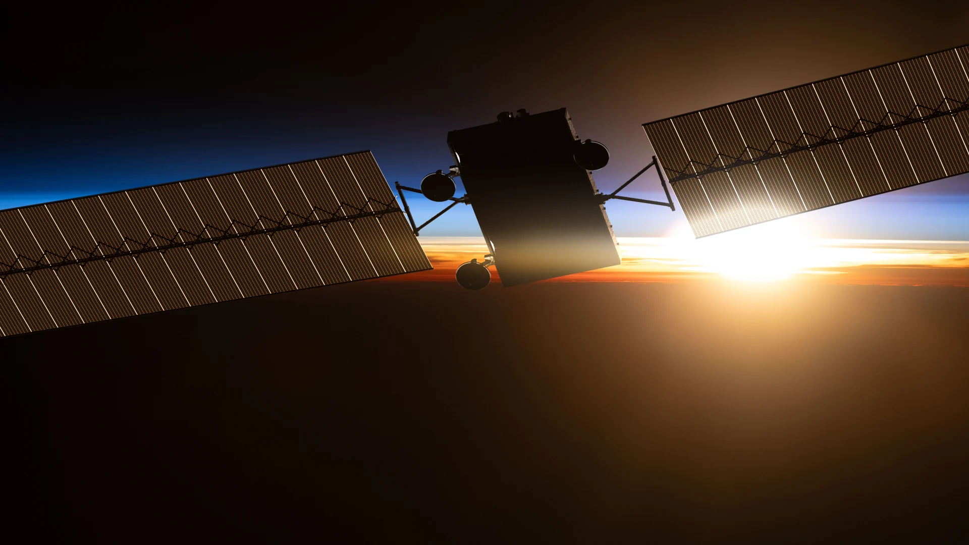 A satellite crossing an orbital sunrise above the Pacific, photographed from the International Space Station